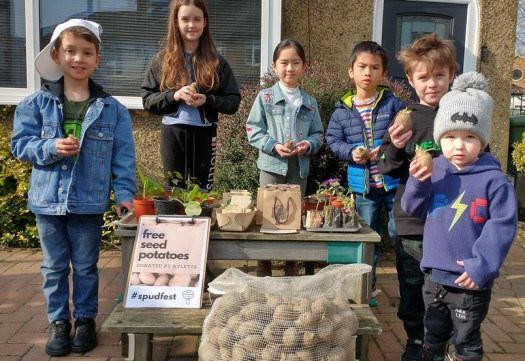 Children holding seed potatoes