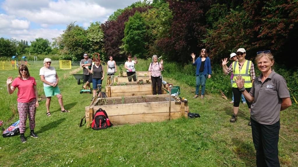 Volunteers by the raised beds